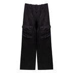 Tom Ford black viscose cargo pants with multiple pockets and relaxed fit, shown on a model.