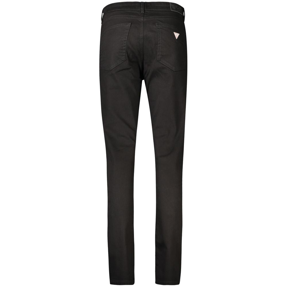Black Guess Jeans women's cotton skinny jeans shown on a model, highlighting slim fit and classic denim style.