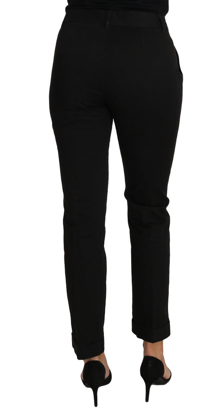 Dolce & Gabbana black cropped straight pants displayed on a hanger with a sleek, minimalist background.