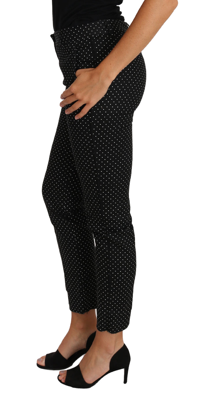 Dolce & Gabbana black polka dot dress with cropped straight pants, stylish and elegant fashion ensemble.