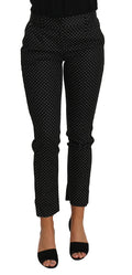 Dolce & Gabbana black polka dot dress paired with cropped straight pants, stylish and elegant fashion ensemble.