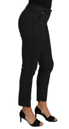 Dolce & Gabbana black polka dot dress and cropped straight pants ensemble, stylish and elegant fashion look.