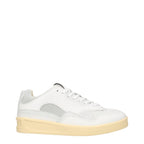 White leather low top sneakers by Jil Sander featuring minimal design and clean stitching, perfect for casual wear.