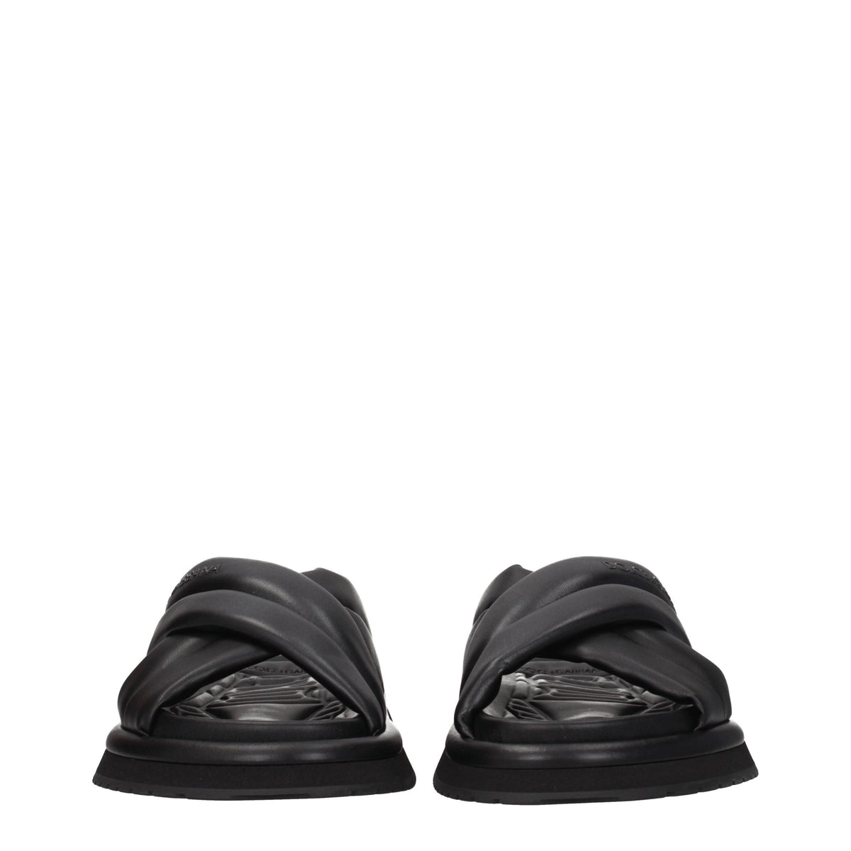 Black leather slippers from Dolce & Gabbana with sleek design and branded detailing, ideal for stylish casual wear.