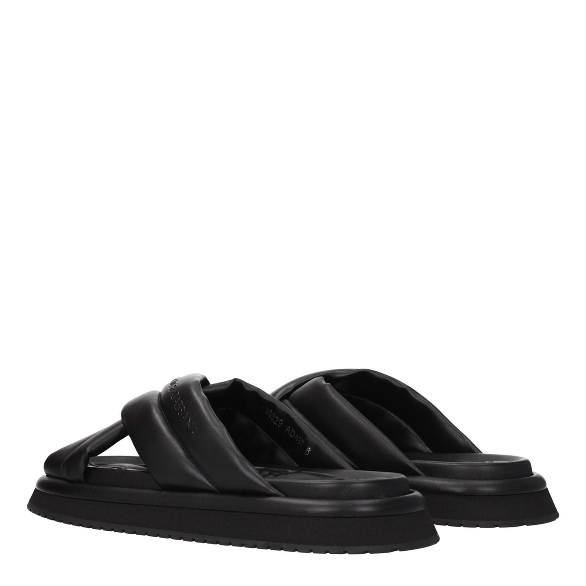 Black leather slippers from Dolce & Gabbana with sleek design and subtle branding, perfect for stylish casual wear.