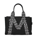 Marc Jacobs black fabric shoulder bag with adjustable strap and minimalistic design, perfect for casual or stylish outings.