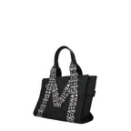 Black fabric shoulder bag by Marc Jacobs with adjustable strap and sleek design, perfect for casual or stylish outings.