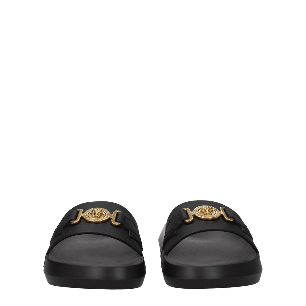Versace black leather slippers with slip-on design and luxurious detailing, ideal for stylish indoor or casual wear.