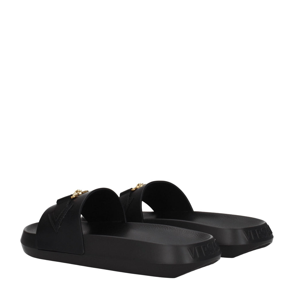 Versace black leather slippers with sleek design, featuring the iconic Medusa logo on the upper for a luxurious look.