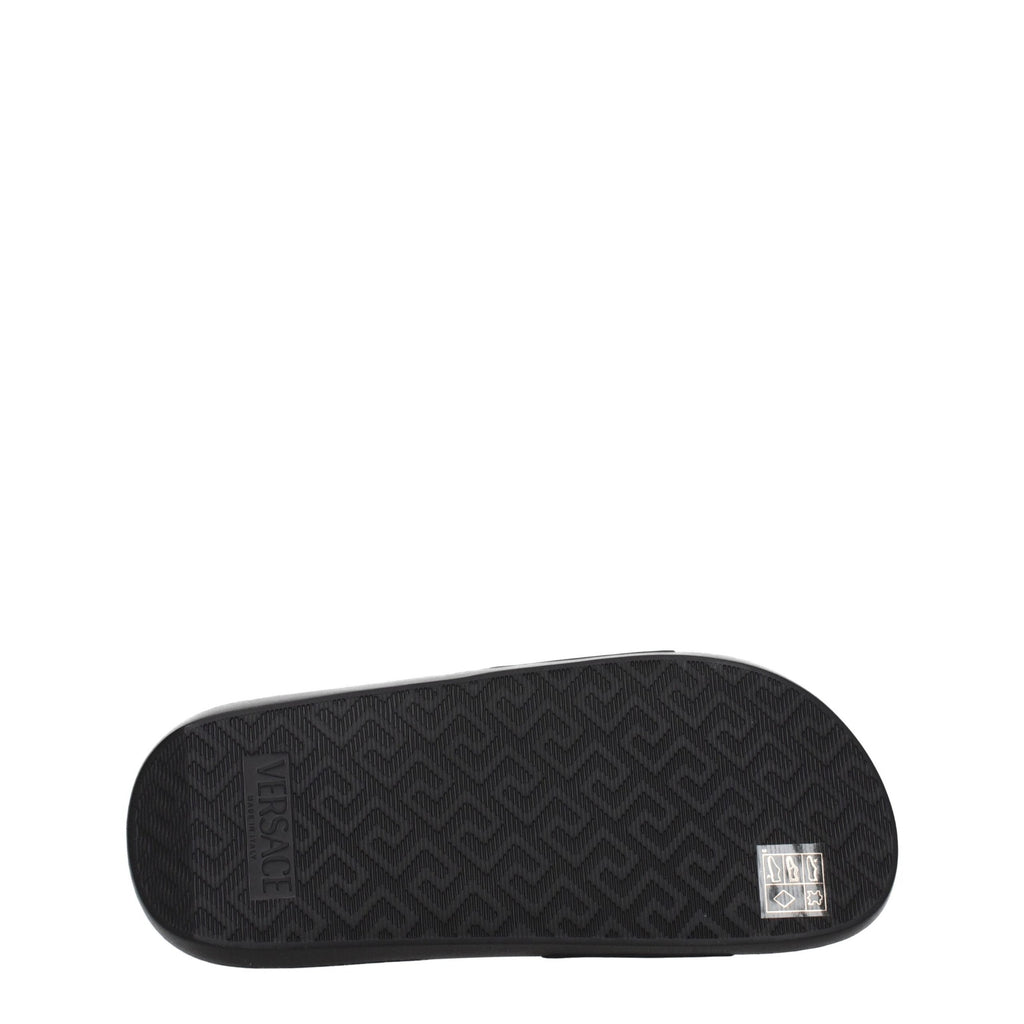 Versace black leather slippers with slip-on design and luxurious finish, featuring the iconic Versace logo.