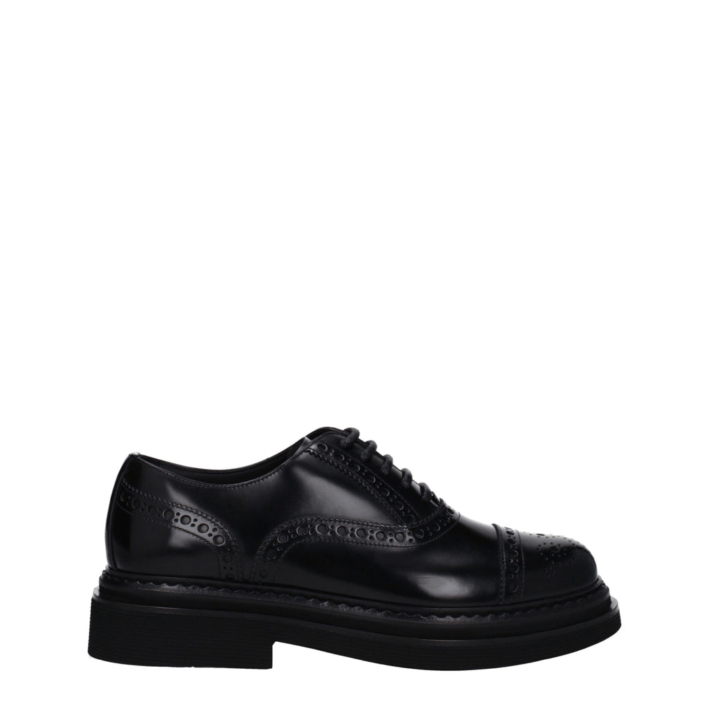 Black leather Dolce & Gabbana oxford shoes and derbies displayed on a clean surface with detailed stitching and classic design.