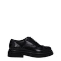 Black leather Dolce & Gabbana oxford shoes and derbies displayed on a clean surface with detailed stitching and classic design.