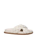 Beige leather slippers by Fabiana Filippi with a sleek design and comfortable slip-on style.