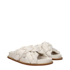 Beige leather slippers by Fabiana Filippi, featuring a sleek design and comfortable slip-on style for casual wear.
