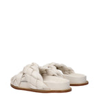 Beige leather slippers by Fabiana Filippi with a sleek design and comfortable slip-on style.