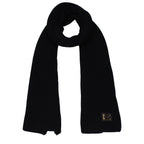 Black cashmere scarf from Dolce & Gabbana featuring a soft, luxurious fabric and classic design, displayed flat in the image.