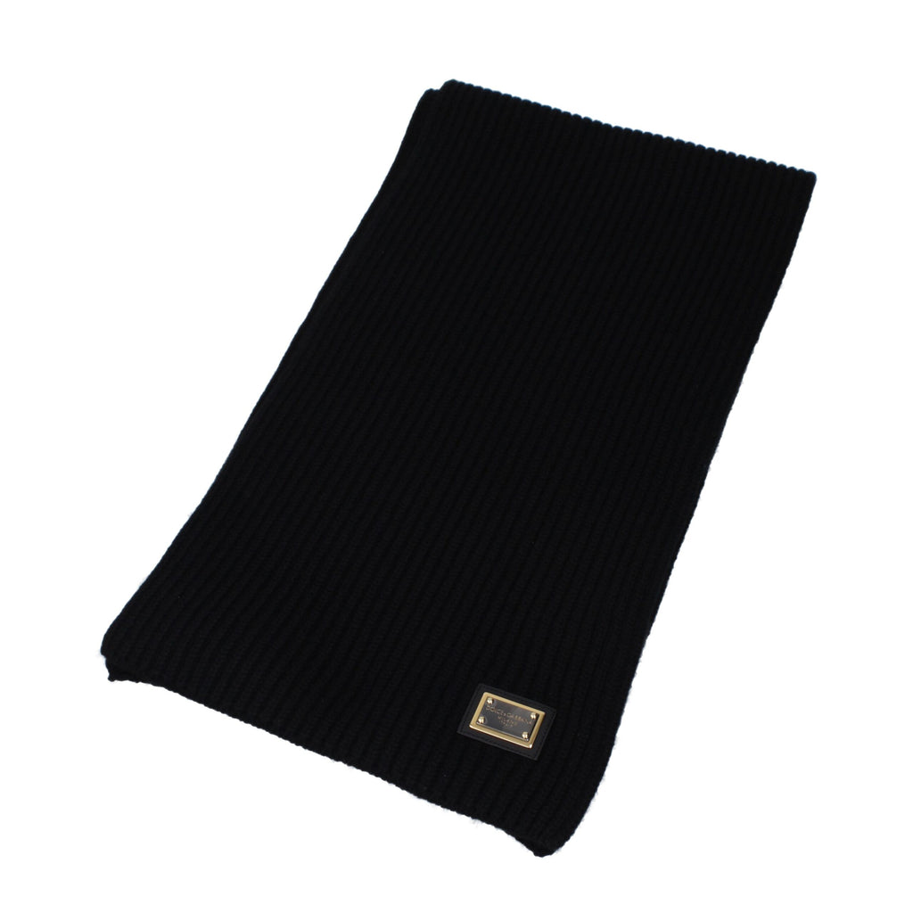 Black cashmere scarf from Dolce & Gabbana with subtle branding and soft, luxurious texture for a stylish winter accessory.