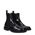 Black leather ankle boots by Dolce & Gabbana with sleek design and pointed toes, perfect for stylish everyday wear.