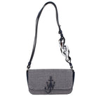 Blue fabric shoulder bag by J.W. Anderson with sleek design and shoulder strap, stylish and versatile accessory.