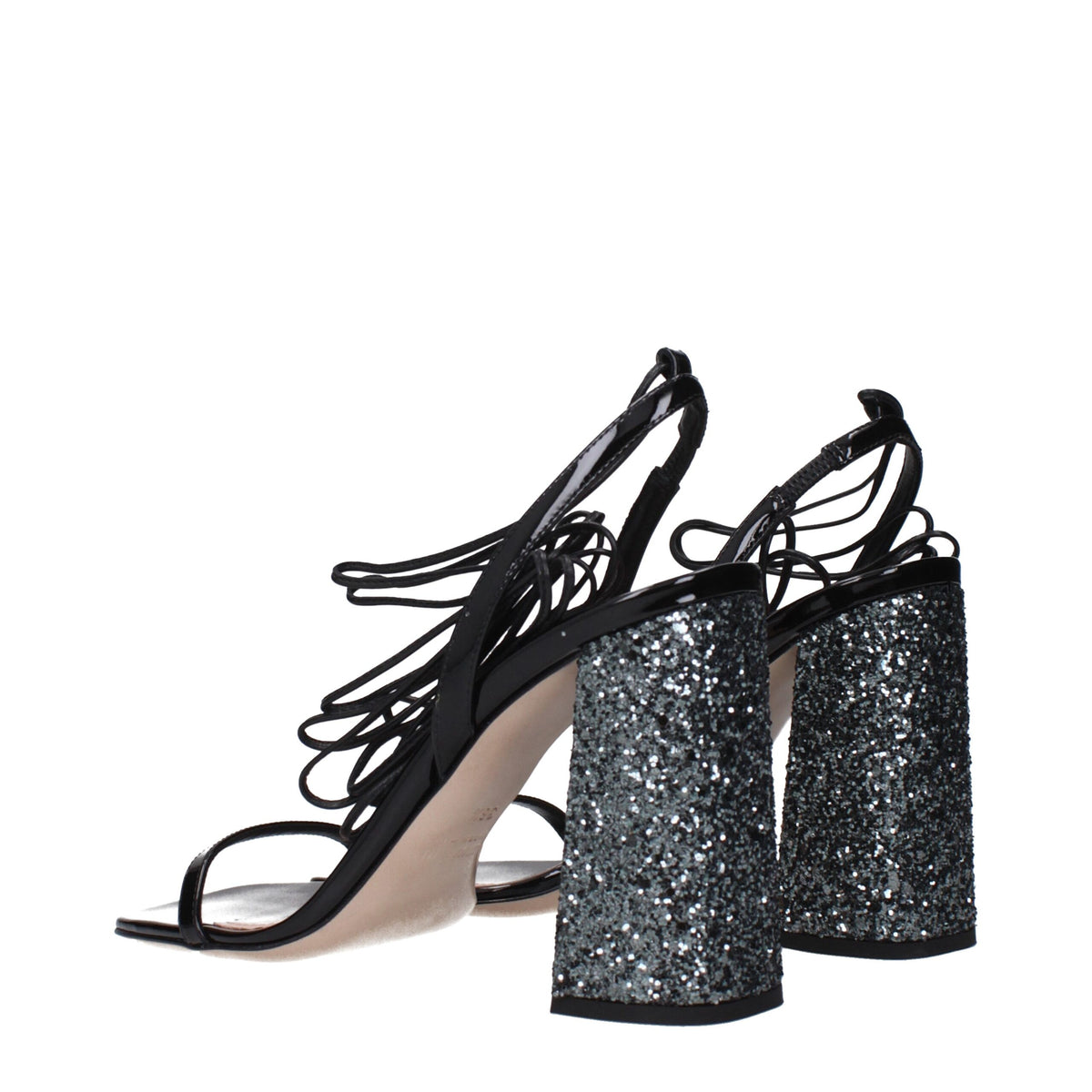 Black leather platform sandals by Miu Miu with chunky heels and open toes, featuring sleek straps and stylish design.