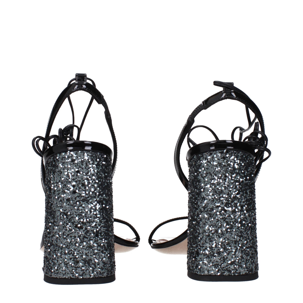 Black leather platform sandals by Miu Miu featuring chunky heels and open toes, stylishly designed for modern fashion.