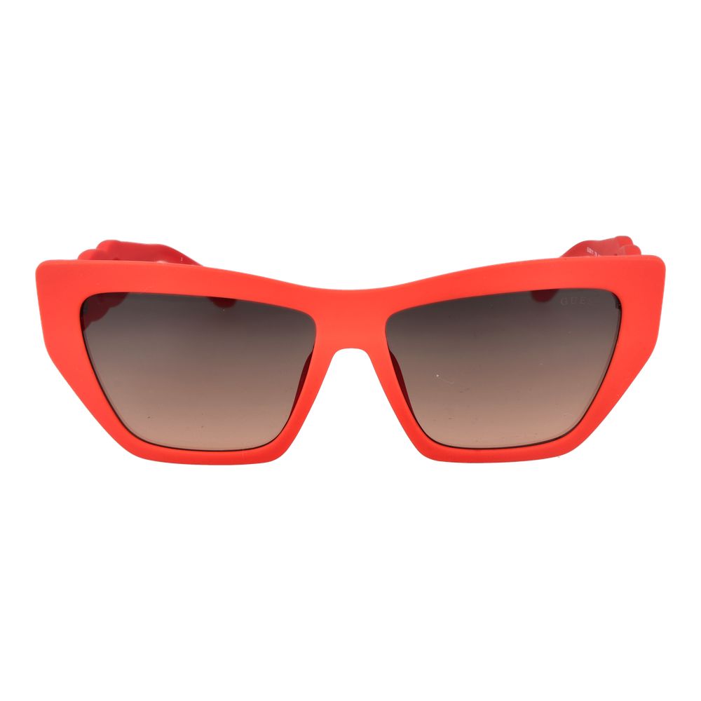 Red plastic Guess sunglasses with a stylish frame and dark tinted lenses, perfect for a trendy summer look.