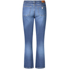 Blue cotton Guess Jeans women's straight fit jeans displayed on a model, showing classic five-pocket design and mid-rise waist.