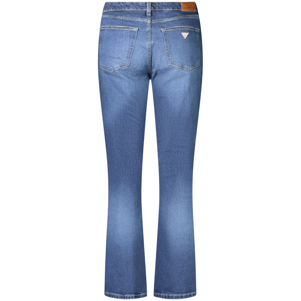 Blue cotton Guess Jeans women's straight fit jeans displayed on a model, showing classic five-pocket design and mid-rise waist.