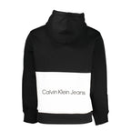 Black Calvin Klein men's sweatshirt made of polyester, featuring a classic crewneck design and subtle branding.