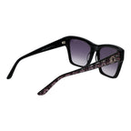 Guess black acetate sunglasses with rounded frames and dark lenses, stylish eyewear for sun protection and fashion.