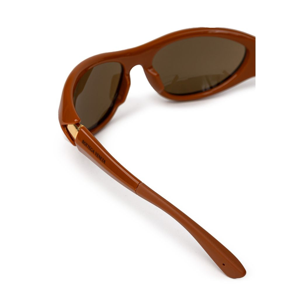 Bottega Veneta brown acetate sunglasses with rounded frames and dark tinted lenses, stylish and luxurious eyewear.