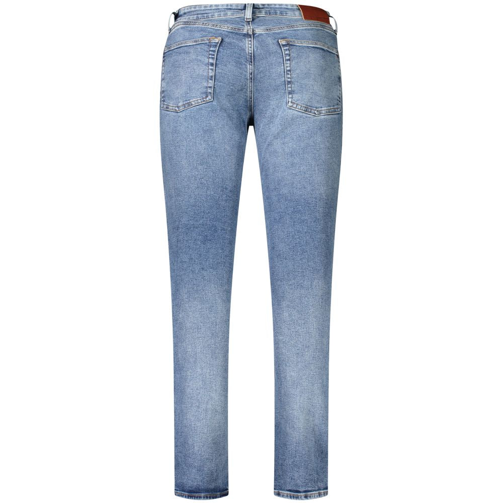 Tommy Hilfiger men's blue cotton jeans with classic five-pocket design and straight fit style.