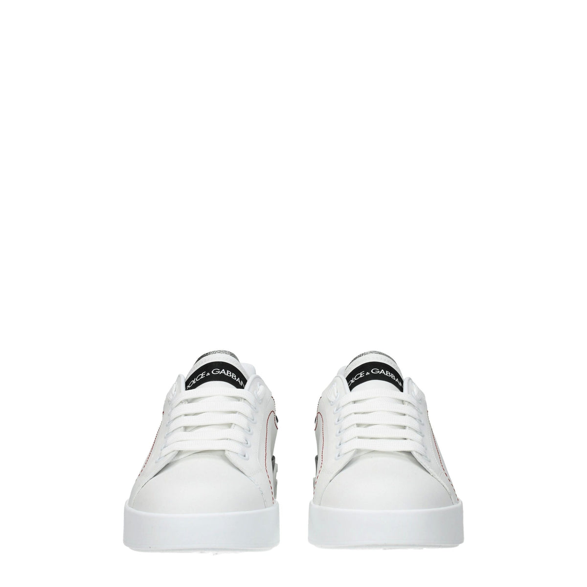 White leather Dolce & Gabbana low top sneakers with sleek design and subtle branding on the side.
