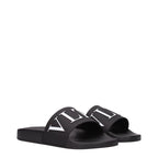 Black cotton slippers by Valentino Garavani with a sleek design and subtle branding, ideal for comfortable casual wear.