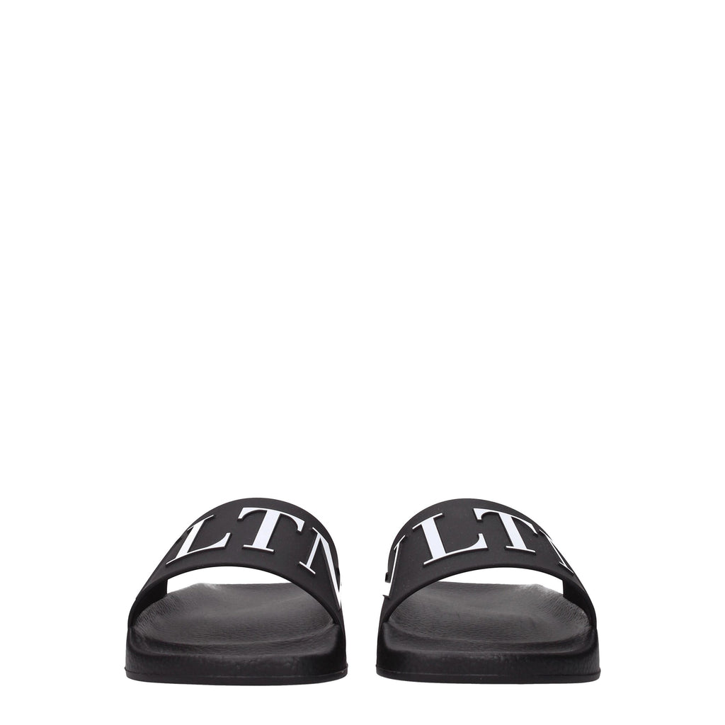 Valentino Garavani black cotton slippers with slip-on design and subtle branding, perfect for casual comfort and stylish wear.