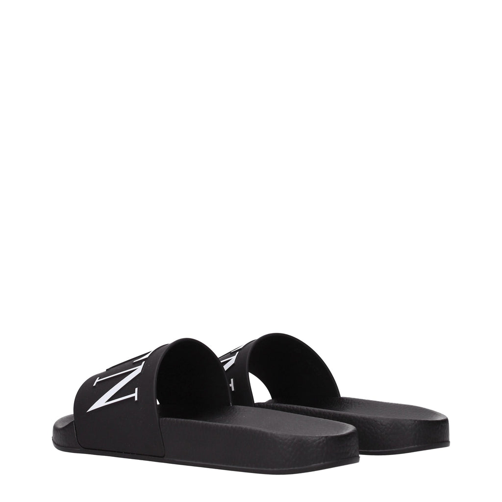 Valentino Garavani black cotton slippers with slip-on design and minimal branding, perfect for casual and comfortable wear.