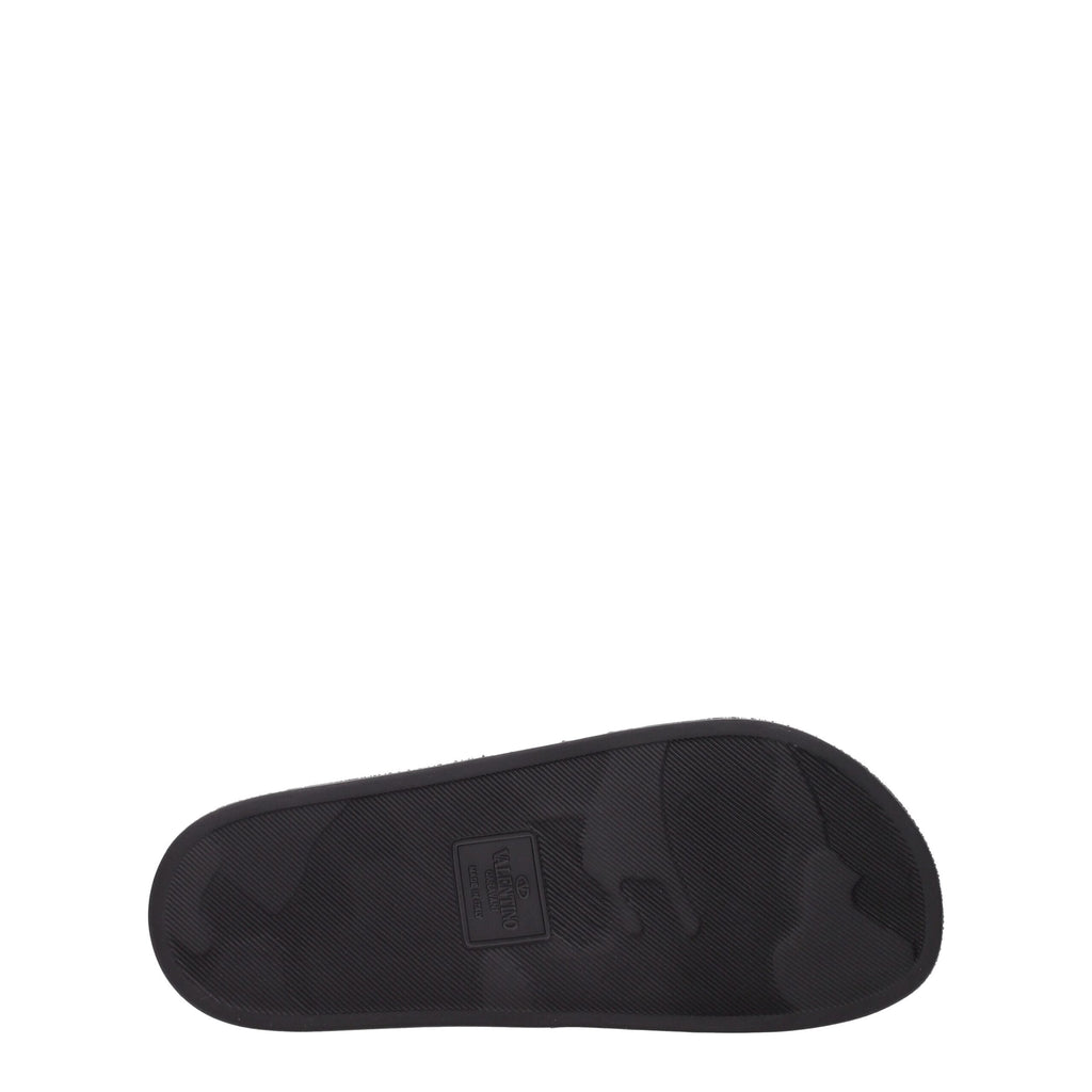 Black cotton Valentino Garavani slippers with a sleek design and logo detail, perfect for casual or lounge wear.