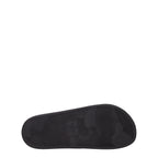 Black cotton Valentino Garavani slippers with a sleek design and logo detail, perfect for casual or lounge wear.