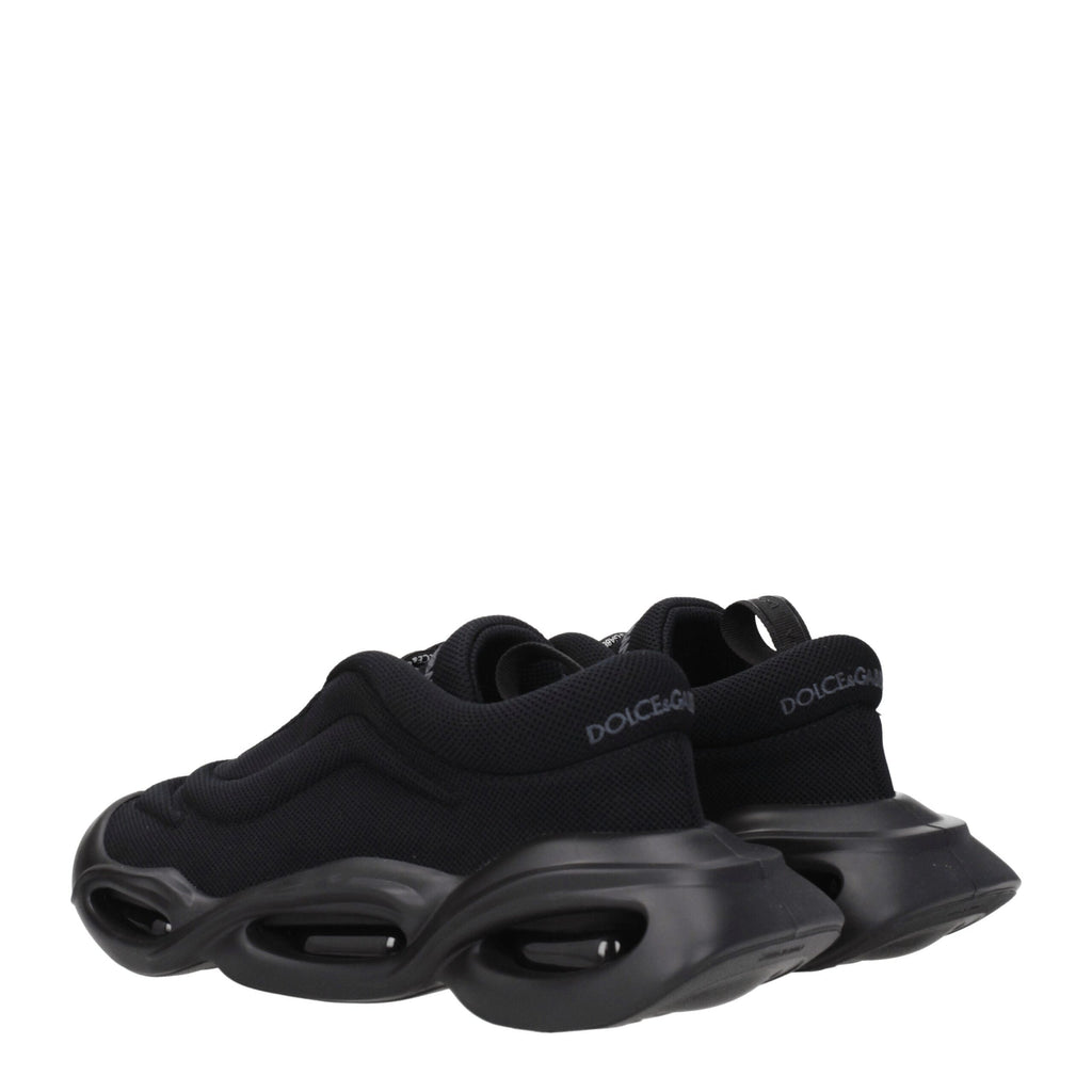 Black fabric chunky sneakers by Dolce & Gabbana with thick soles and stylish design, perfect for casual and trendy outfits.