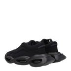 Black fabric chunky sneakers by Dolce & Gabbana with thick soles and stylish design, perfect for casual and trendy outfits.