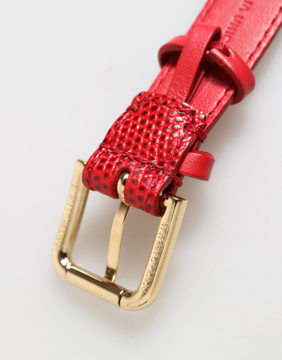 Dolce & Gabbana red exotic leather women’s armband with gold-tone metal buckle and intricate detailing.