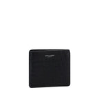 Saint Laurent black calf leather Bos Taurus wallet opened to show card slots and interior design.