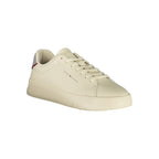 Tommy Hilfiger beige polyurethane men's sneaker with white sole and laces, showcasing a casual athletic footwear design.