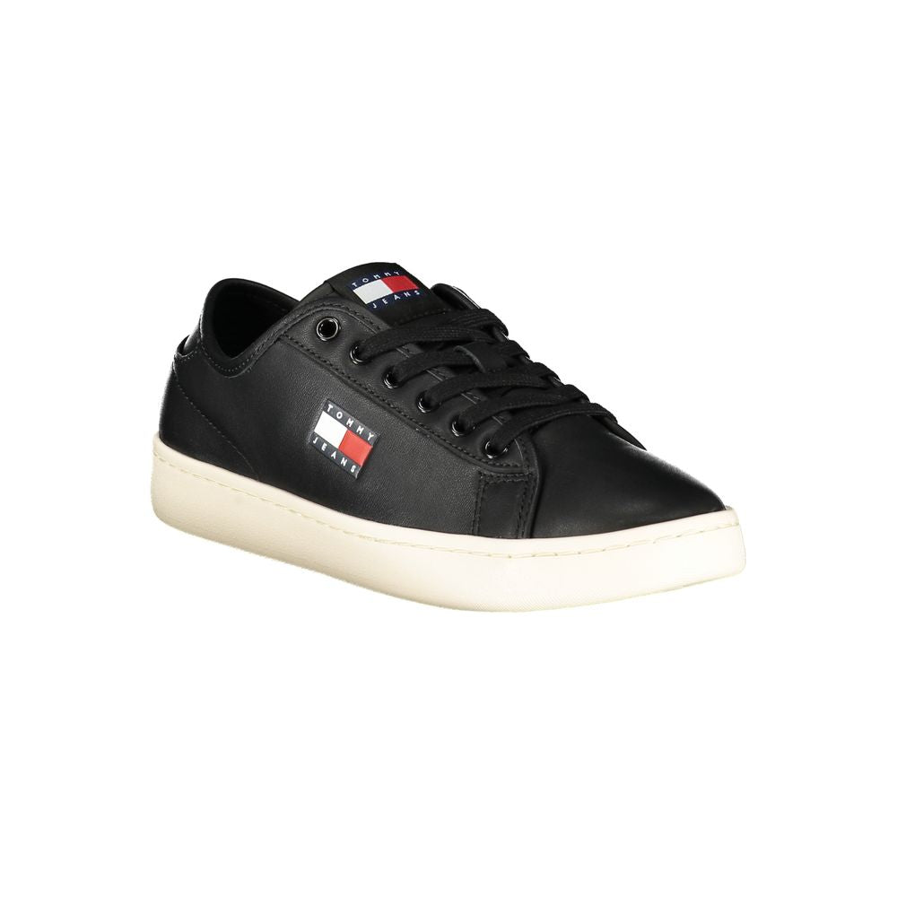 Tommy Hilfiger black polyurethane women's sneaker with white sole and stylish design, showcasing casual athletic footwear.