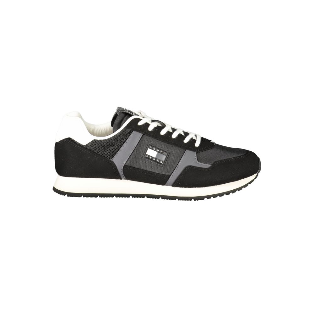 Tommy Hilfiger Nero men's polyurethane sneaker with sleek black design and white sole, casual athletic footwear.