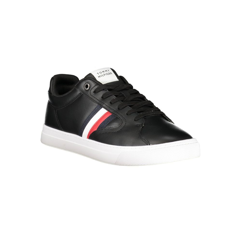 Black Tommy Hilfiger men's polyester sneaker with white sole and logo detail, positioned on a plain background.