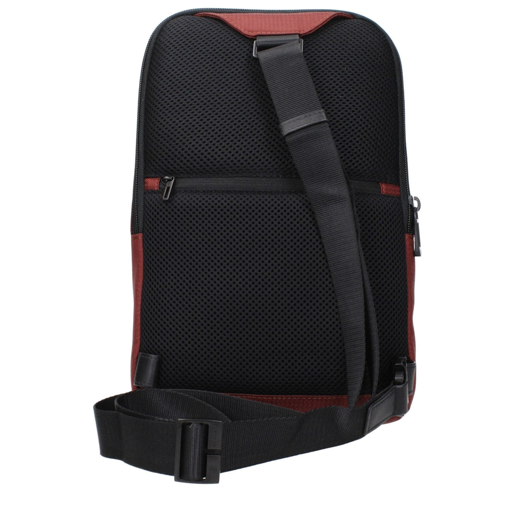 Piquadro red fabric crossbody bag with adjustable strap and multiple compartments, designed for everyday use.