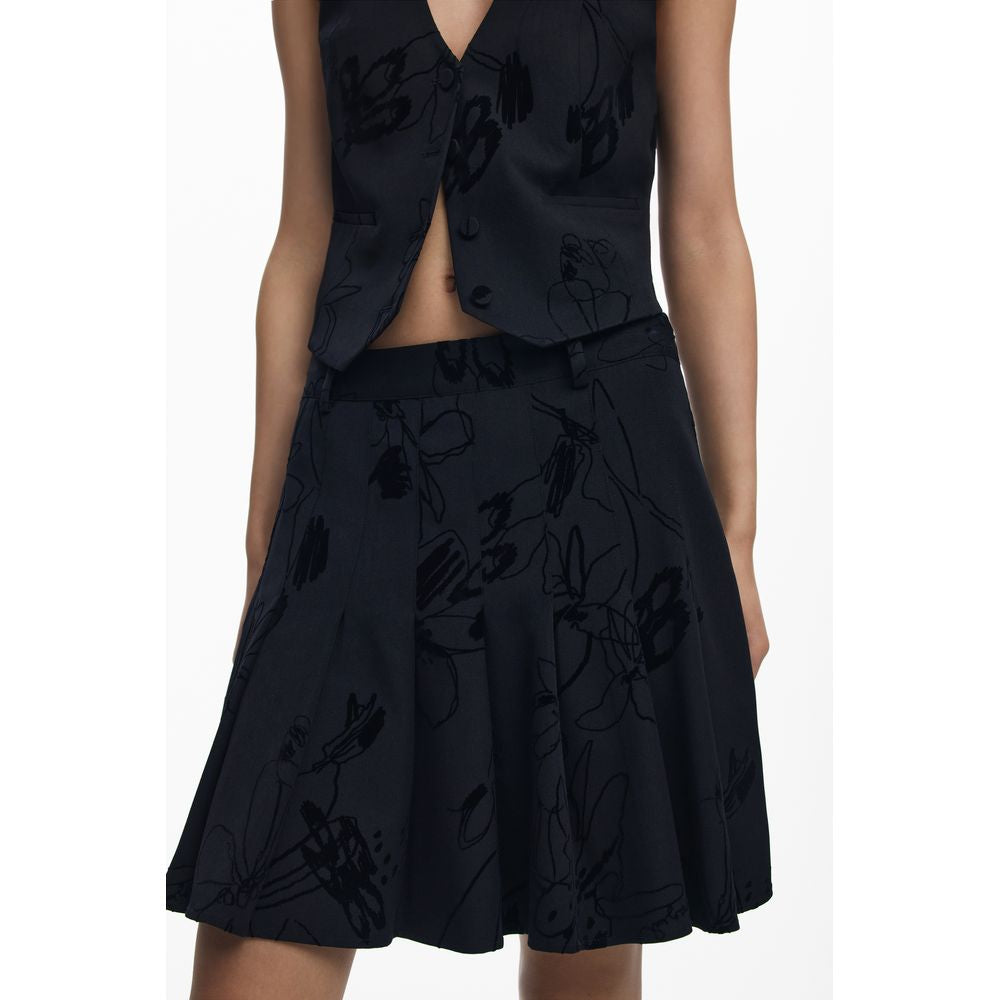Black polyester women's skirt by Desigual featuring a stylish design, shown on a model with a flowing fit and modern silhouette.