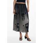Black polyester women's skirt by Desigual with a fitted waist and flowing design, shown on a model.