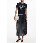 Black polyester women's skirt by Desigual, shown with a sleek, fitted design and subtle detailing, perfect for casual or dressy occasions.
